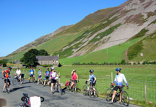 Cyclists cycling in Snowdonia National Park